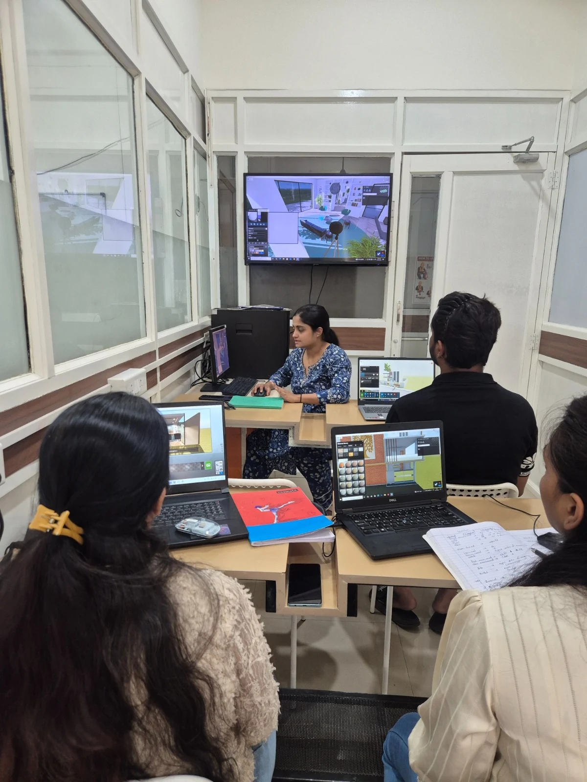 AICT learners using interior design software during a faculty-led computer session