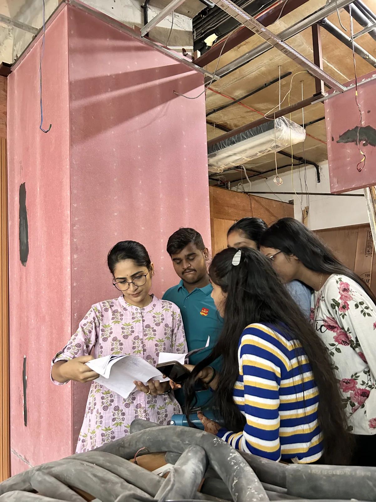 AICT learners reviewing construction site details with an instructor